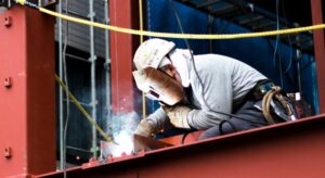 man-welding-a-metal-structure-XZWVLMW.jpg